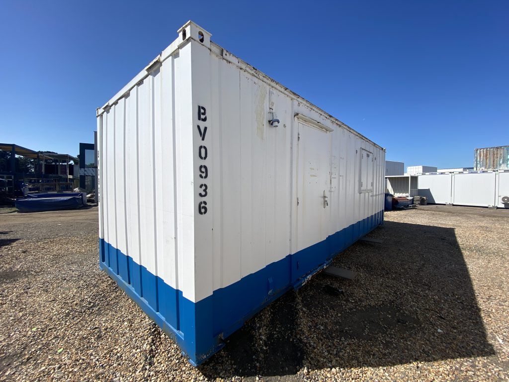 A used white and blue modular building