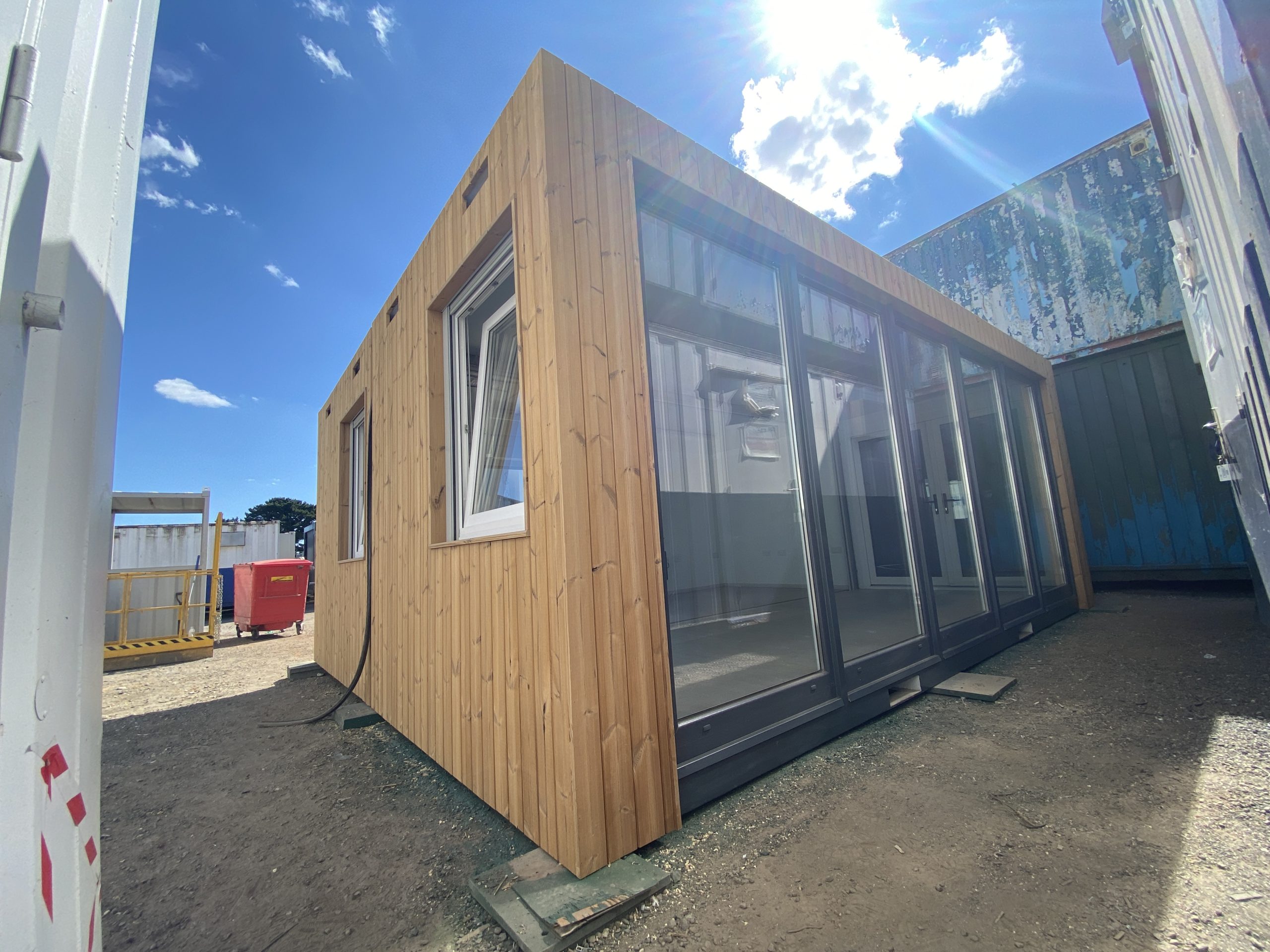 The exterior of a modular building with wooden panelling